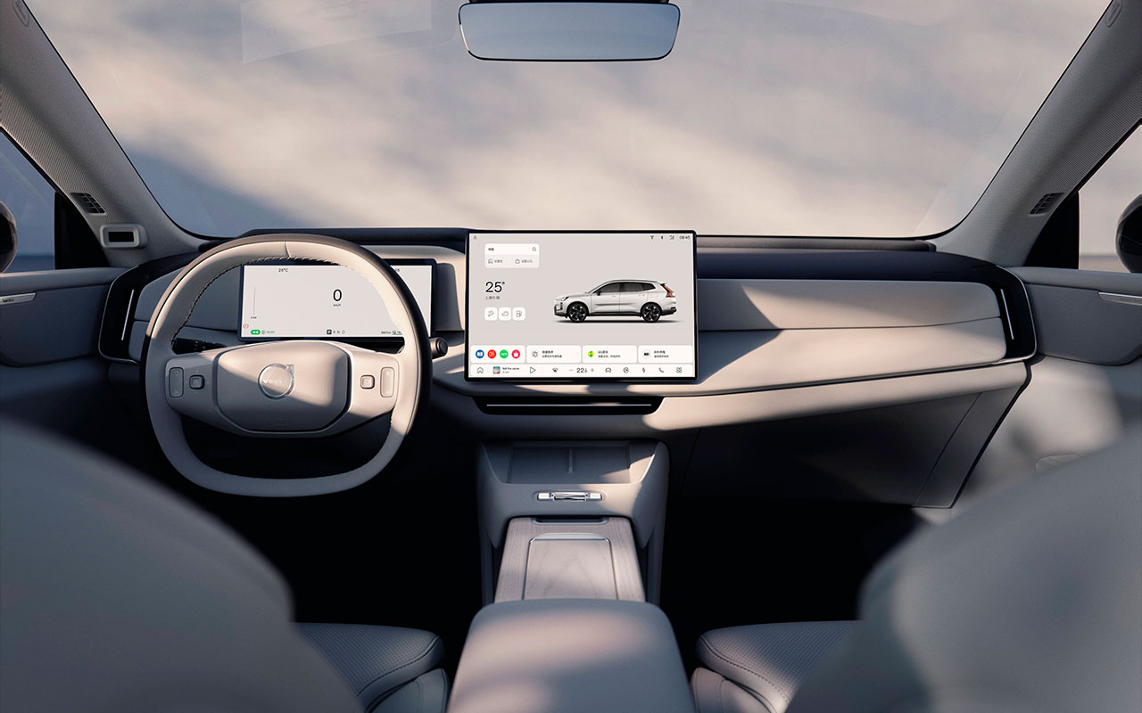 Cabine do Volvo XC70 com volante e telas do painel
