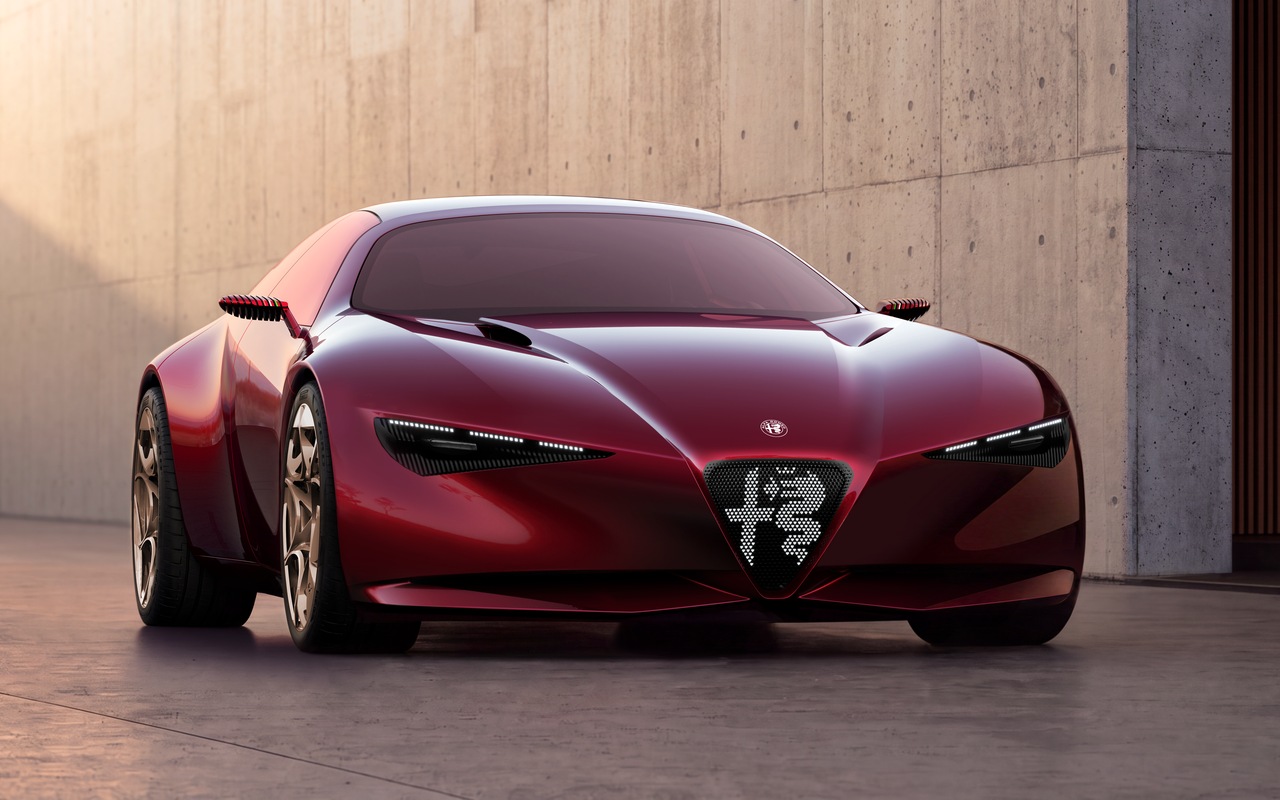 Alfa Romeo Cuorerosso vermelho visto de frente em três quartos diante de parede de concreto